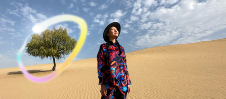 iPad Pro, front exterior display with dark blue and green gradient background with multiple apps open, hand holding Apple Pencil Pro circling a sketch showing Apple Intelligence Image Wand feature